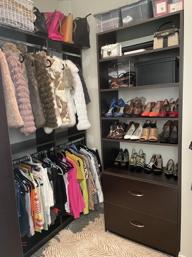 Dark wood closet system with shoes, clothes, and purses before and after - After